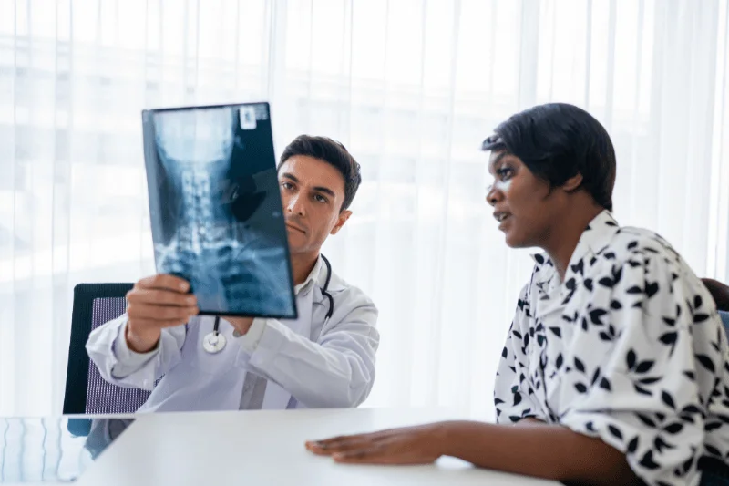 A Spine Surgeon Explains a Laminectomy to a Patient in South Florida