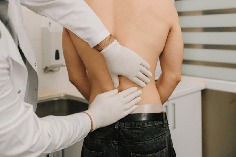 Scoliosis Exam in a Spine Surgery Clinic in South Florida