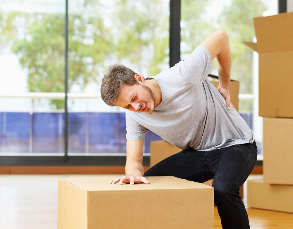man holding back in pain